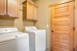 Mud room from garage to kitchen with washer and dryer